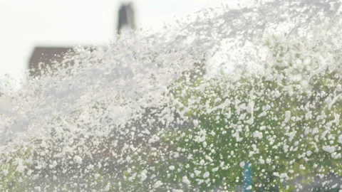 Foam flies out of the fire hose in a jet for extinguishing the fire. Видео 240701753