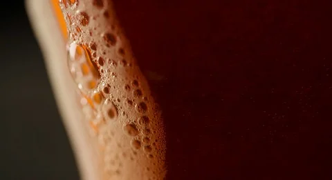 Foam is flowing on side of Beer Glass slow motion Stock Footage 103638528