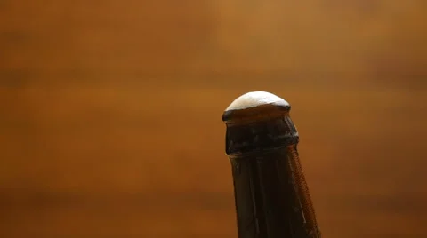 Foam flows down on a brown beer bottle (No 1.3) Stock Footage 67295771