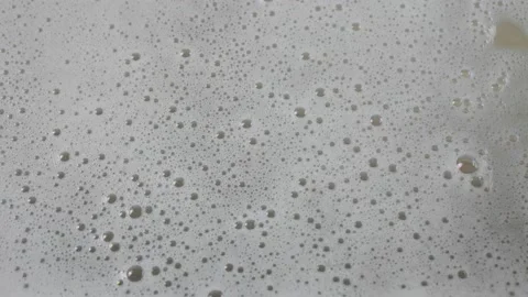 Foam flows down the glass, close-up Stock Footage 220122518