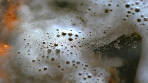 Foam head settling on pint of beer Stock Footage 42096809