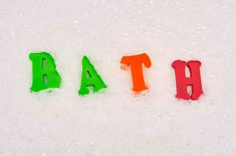 Foam letters in soap bubbles Stock Photos