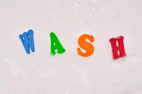 Foam letters in soap bubbles 库存照片