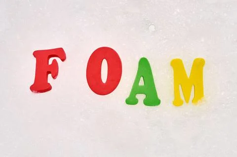 Foam letters in soap bubbles Stock Photos