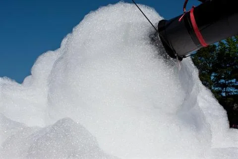 Foam machine makes high volume of bubbles at event Stock Photos