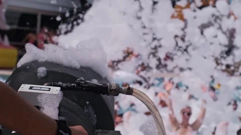 Foam party at the pool: epitome of resort fun. Ideal for hotel resorts, entertai Видео 270084882