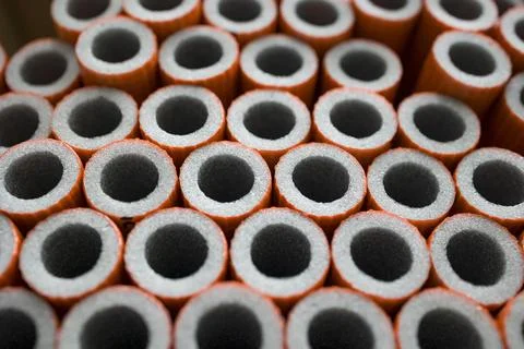 Foam pipe insulation texture background . Selective focus . Stock Photos