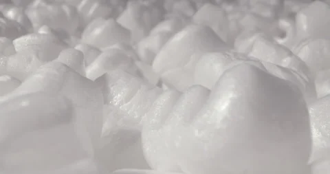 Foam plastic white packaging filler in the form of numbers, environmental pol Stock Footage 317538540