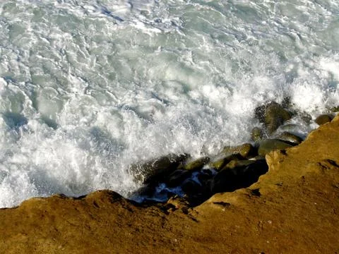 Foam on the rocks-1 Stock Photos