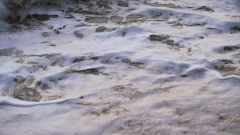 Foam Rolling Down a Breaking Shore Break Video stock 342487278
