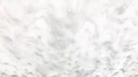 Foam is running down the front window of a car in the car wash Stock Footage 69233087
