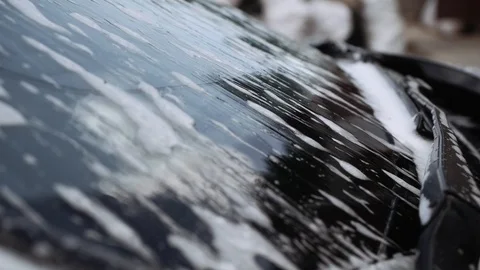 Foam runs down a car window. Stock Footage 108849784