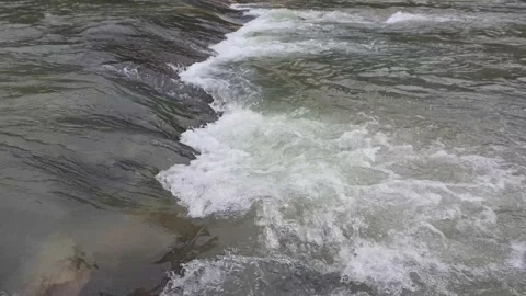 The foam of the rushing river Stock Footage 195974530