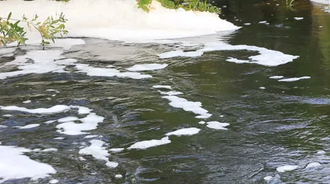 Foam from rushing stormwater Stock Footage 43247615