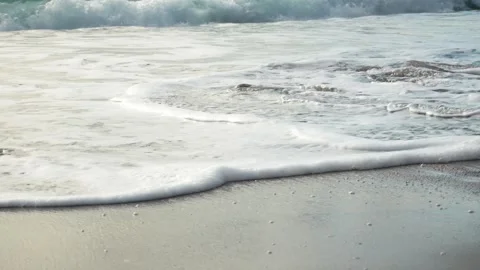 Foam of the sea waves on the sandy shore. Stock Footage 257207888