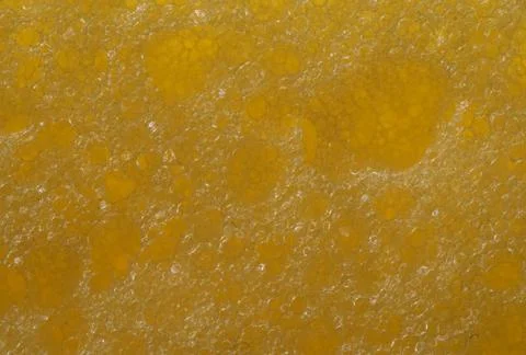 Foam seamless texture, brown sponge. Stock Photos