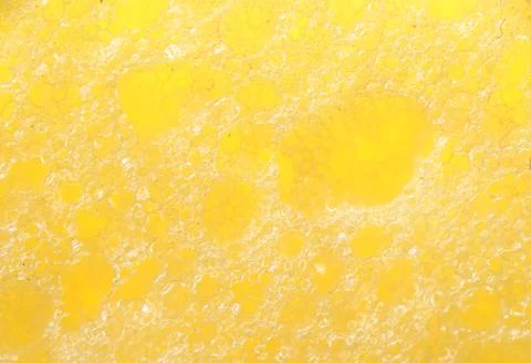 Foam seamless texture, yellow sponge Stock Photos