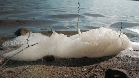 Foam on the shore of a fresh water lake Stock Footage