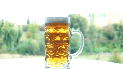 Foam sliding down side of beer glass Stock Footage 94975914
