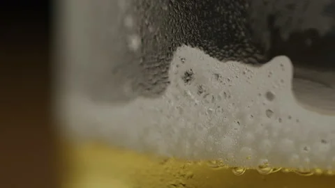 Foam Slowly Sliding Down the Side of a Beer Lass Stock Footage 208796438