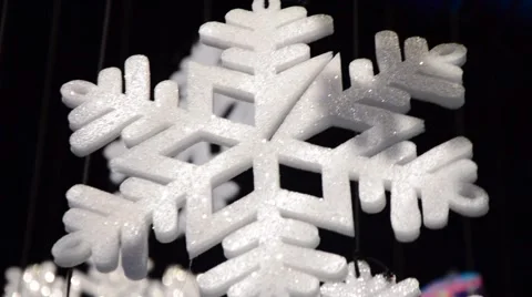 Foam snowflake hanging from the ceiling in a beautiful light Stock Footage 59081348