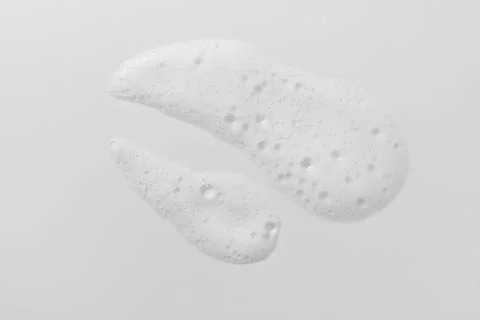 Foam swatch on white background. Soapy liquid texture with bubbles. Stock Photos