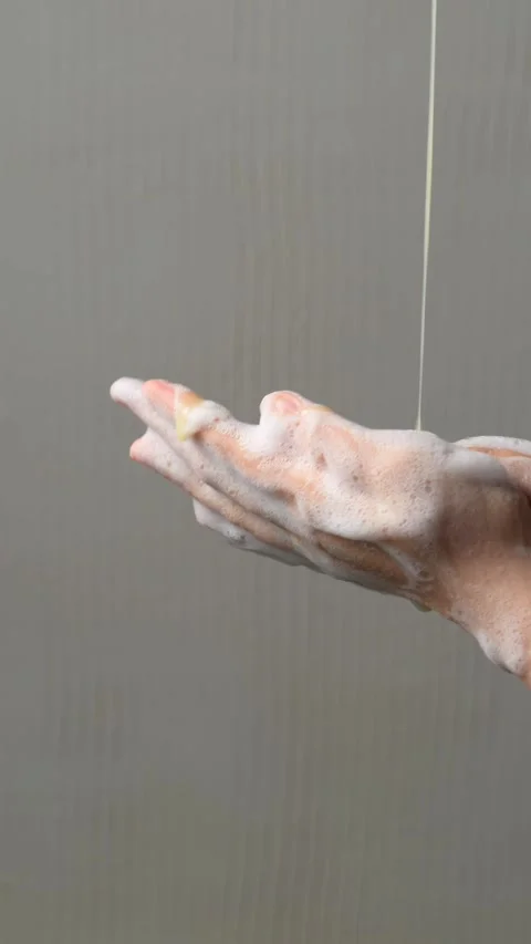 Foam texture and young Asian woman's hands Stock Footage 304213191