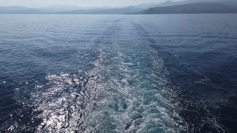 Foam trail on the water surface behind of cruise ship. Stock Footage 122926080
