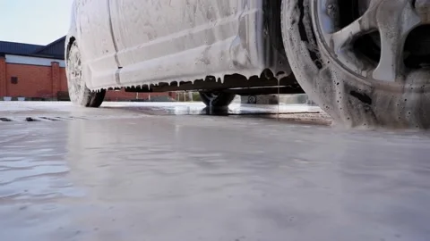 Foam for washing the car flows down the body and glass of the car. Stock Footage 170452703