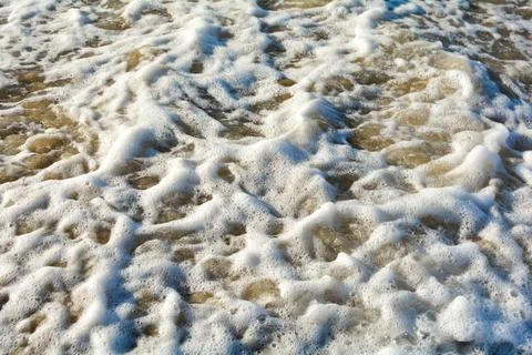 Foam of a wave Stock Photos