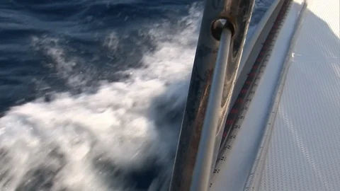 Foam, waves and water on camera during movement of yacht 動画素材 118801554