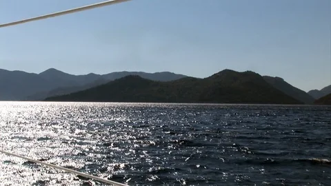 Foam, waves and water on camera during movement of yacht 動画素材 118801563