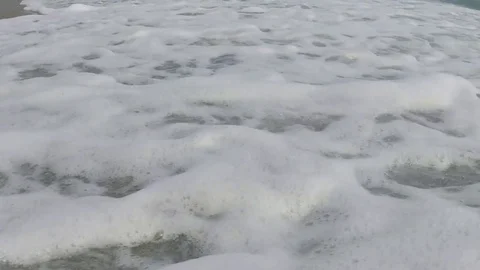 Foam of Waves in the Beach Stock Footage 75890607