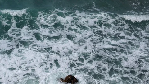 Foam of Waves Moving between the rocksTexture Background Stock Footage 89614518