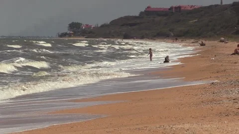 Foam waves run over the sea sand Stock Footage 145733403