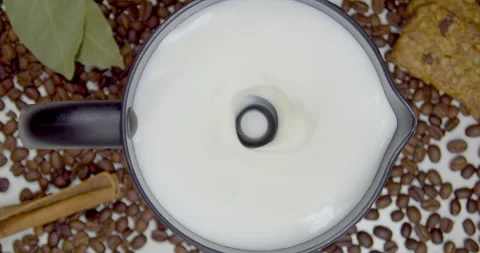 The foam whipping machine creating a foam of whipped milk for coffee Stock Footage 165669820