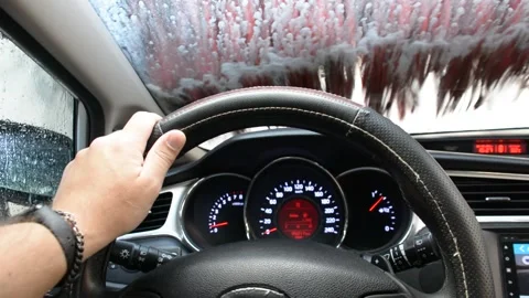 Foam on the windshield. Washing the dirt from the machine with foam. View from c Vidéo 161157832