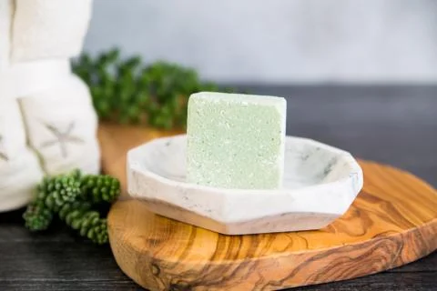 Foaming bath bomb in spa setting Stock Photos