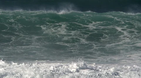 A foaming green wave curling and falling, preceded by its shadow Stock Footage 59526727