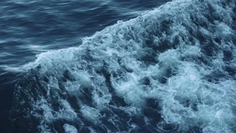 Foaming hull wave rolling over deep blue sea from a ship Stock-Footage 347827018