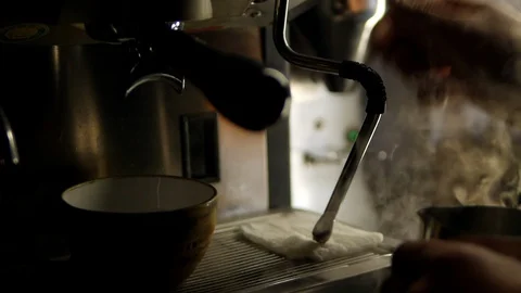 Foaming milk, steam coffee machine. making coffee. Stock Footage 129173485