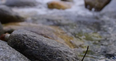 Foaming river water with stone, sharpening from front to back Stock Footage 69937104