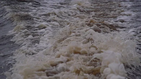 Foaming splashes of water formed by the movement of a motor boat Stock Footage 54898642