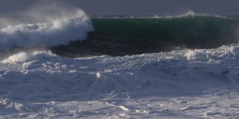 Foaming surf with a gathering green wave close behind it Stock Footage 59526735