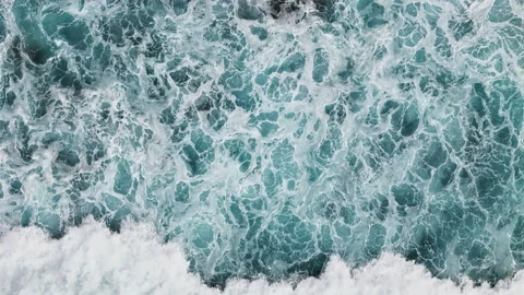 Foaming turquoise ocean surface with dense whitewater patterns Stock Footage 340068474