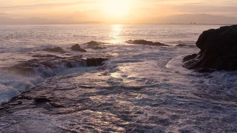 Foaming Wave Over Reef Rock With Fuji Mountain Landscape Colorful Sky Sunset Video stock 128946716