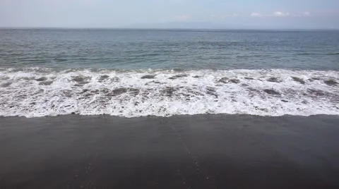 Foaming Waves on the Black Volcanic Beach. Slow Motion Stock Footage 67259080