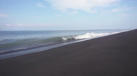 Foaming Waves on the Black Volcanic Beach. Slow Motion Stock Footage 67259406