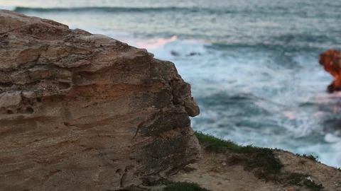 Foaming waves crash against the cliffs of the ocean Stock Footage 130001754