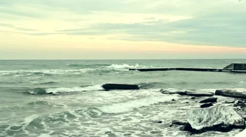 Foaming waves crashing on the pier 스톡 동영상 55425186